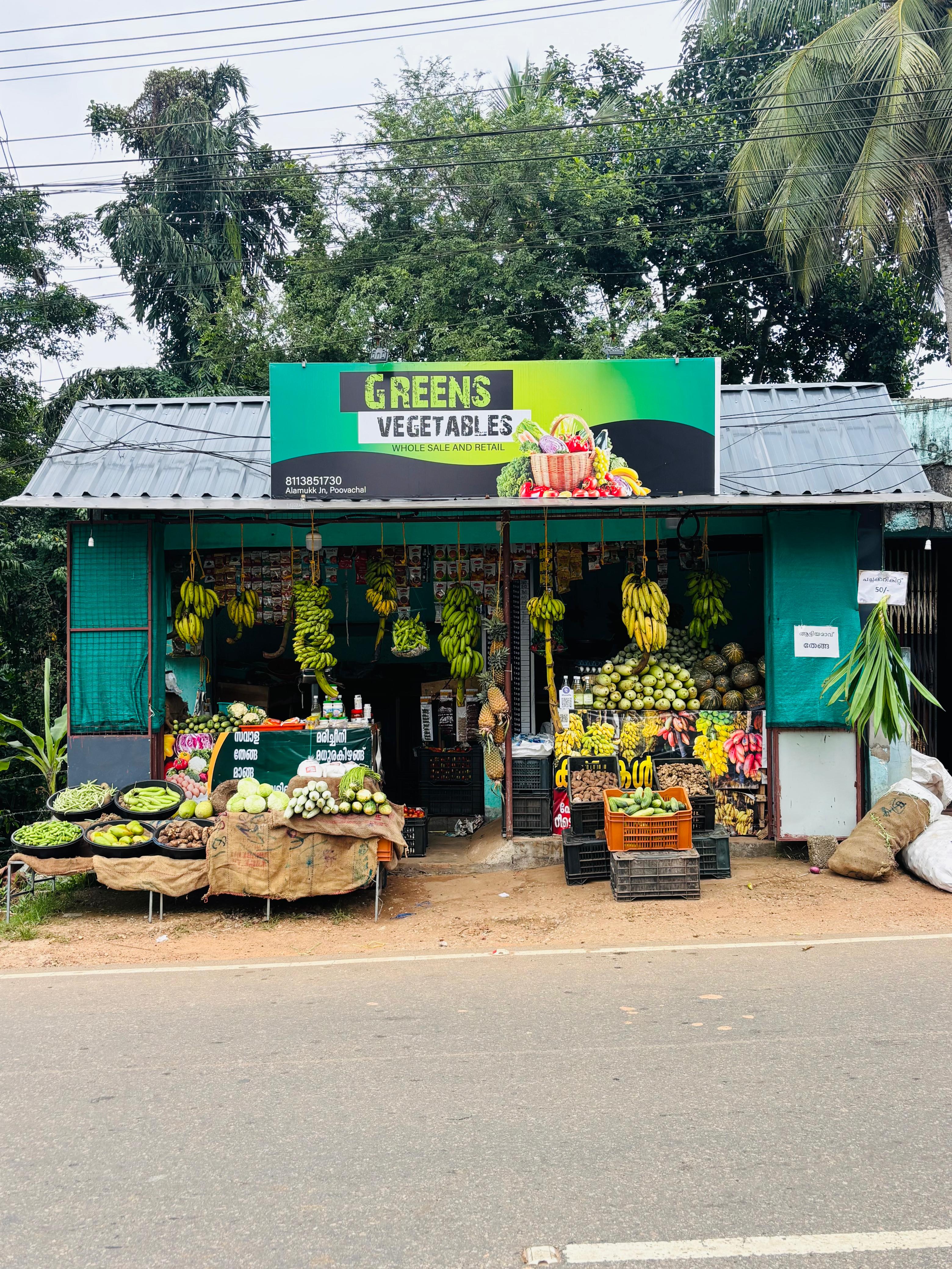 Colorful assortment of fresh vegetables including tomatoes, carrots, and leafy greens from GREENS VEGETABLES in Trivandrum.